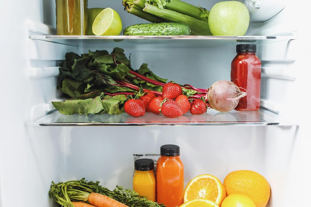 Fridge with healthy fruits and veggies